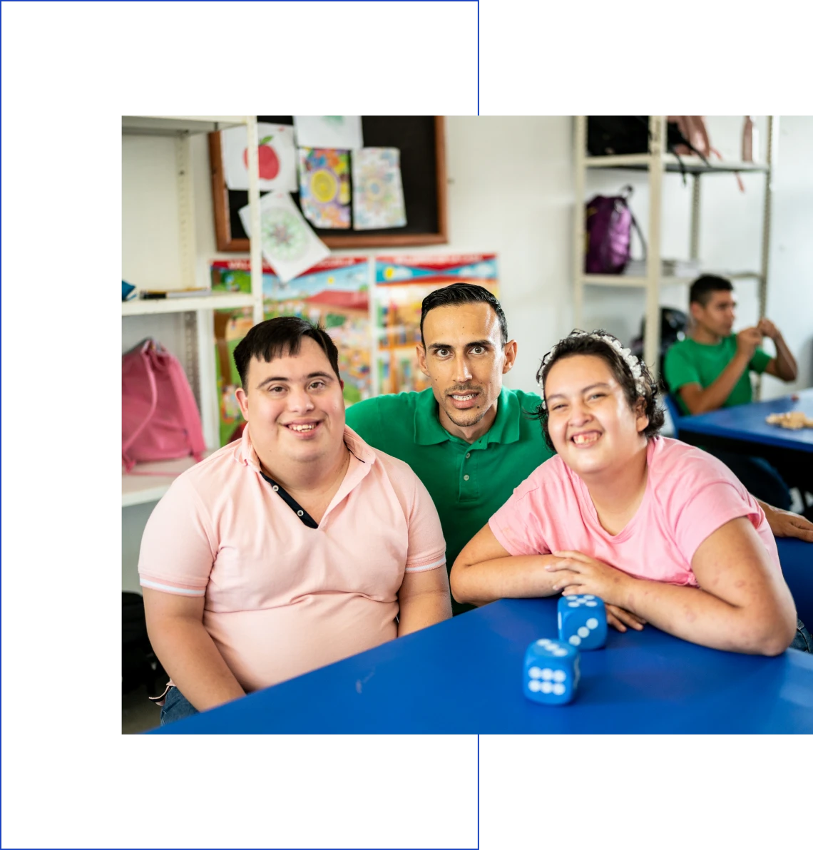 Group smiling in a classroom setting.